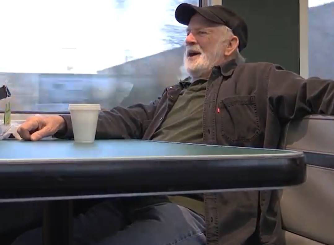 Joe Veasey rides train.jpg